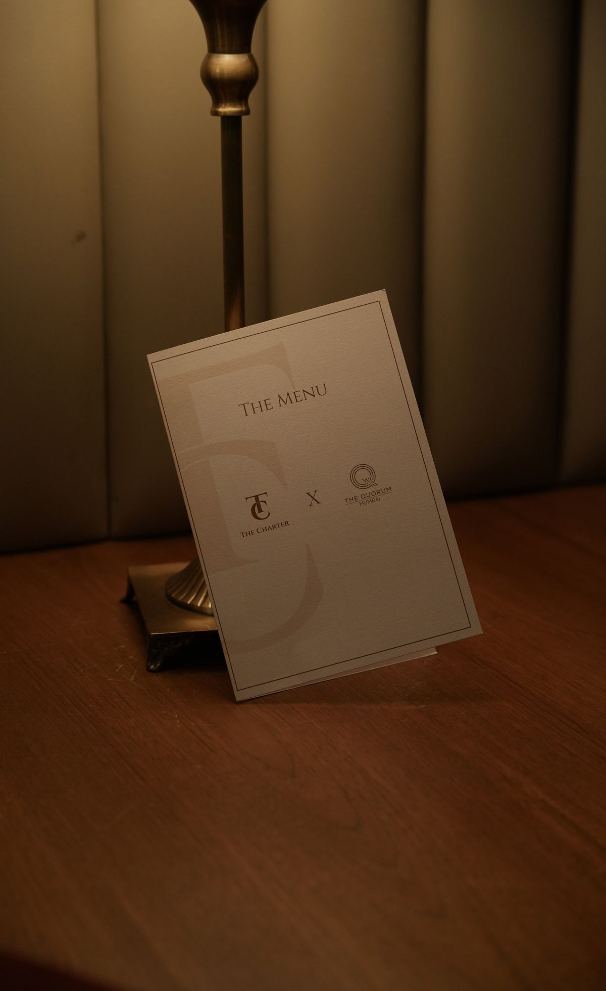 An invitation card resting on a table.