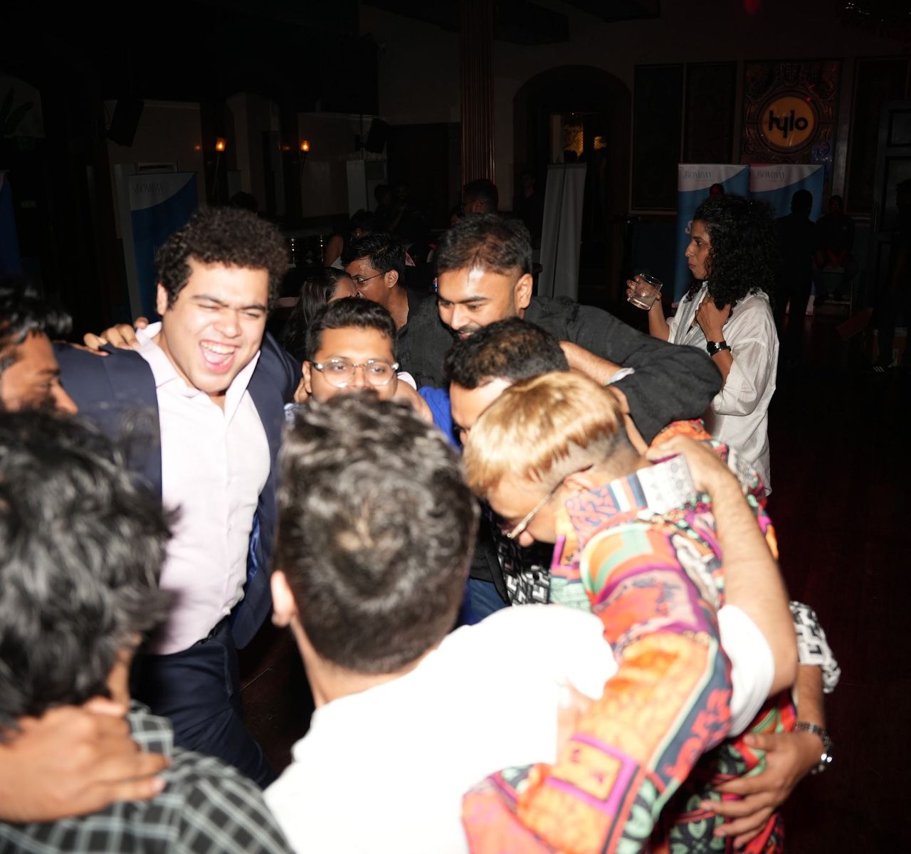 Members celebrating together at a late-night gathering.